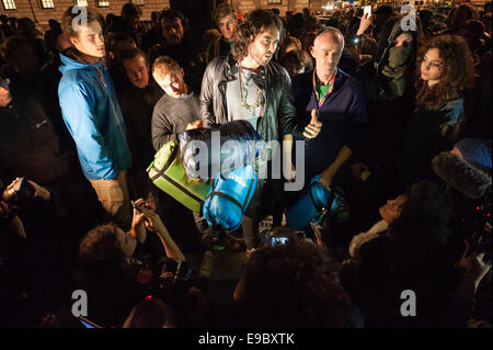 Parliament Square, London, UK. 23rd October 2014. Russell Brand visits the Occupy demonstration in Parliament Square, London, to give a short speech and to supply sleeping bags to protesters intending on stopping the night opposite Parliament. Credit:  Lee Thomas/Alamy Live News Stock Photo