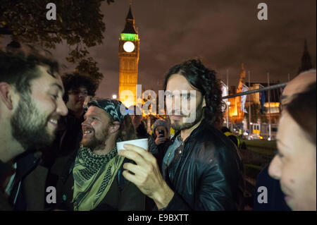 Parliament Square, London, UK. 23rd October 2014. Russell Brand visits the Occupy demonstration in Parliament Square, London, to give a short speech and to supply sleeping bags to protesters intending on stopping the night opposite Parliament. Credit:  Lee Thomas/Alamy Live News Stock Photo