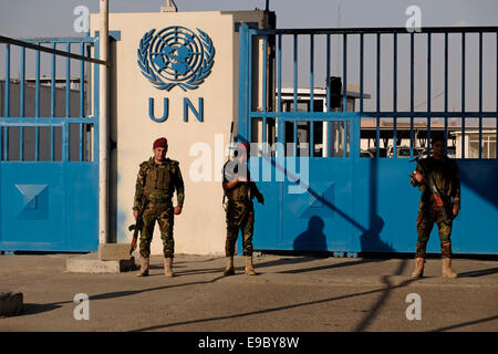 Kurdish Peshmerga soldiers stand guard in front of UN headquarters in the city of Erbil also spelt Arbil or Irbil the capital of the Kurdistan Region northern Iraq. Stock Photo