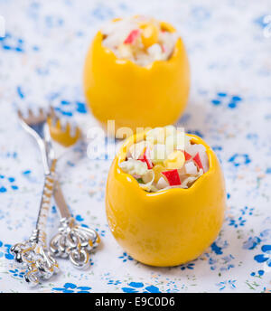 Fresh vegetable salad with corn, cabbage, crab and mayonnaise in egg-shaped bowls, selective focus Stock Photo