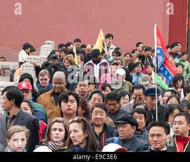 Beijing, China. 26th Oct, 2006. Faces of tourists show great diversity as they walk down the steps at the rear of The Hall of Supreme Harmony (Taihe Dian), the largest hall within the Forbidden City. Together with the Hall of Central Harmony and Hall of Preserving Harmony, the three are the heart of the Outer Court of the Forbidden City. In the center of Beijing, the Forbidden City complex of 980 buildings, built in 1406-1420, was the Chinese imperial palace for 500 years from the Ming dynasty to the end of the Qing dynasty and was home to emperors and their households, as well as the ceremon Stock Photo