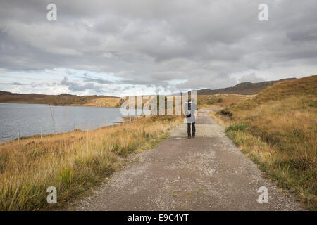 Walker by Loch Kernsary near Poolewe, Nw Highlands of Scotland Stock Photo
