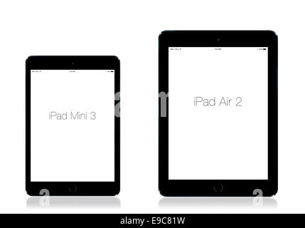 Tablets iPad mini 3 and iPad air 2 space gray, white background, reflection. Stock Photo