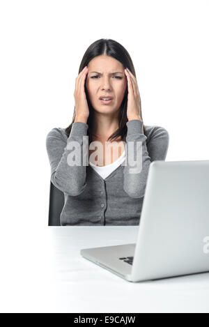 Young Woman Suffers from headache or migraine Facing Laptop on the Table. isolated on White Background Stock Photo