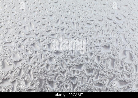 Metal surface covered in water drops bottom, closeup. Stock Photo