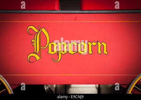 Vintage Style Yellow Popcorn Print Isolated on Red Background. Stock Photo