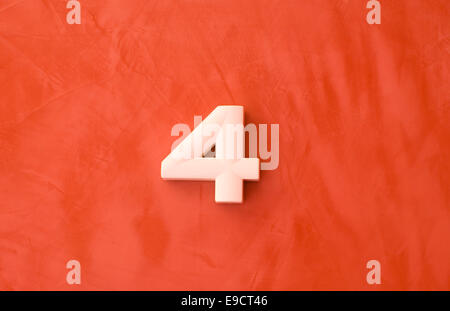 Number four 4 on red marble background Stock Photo