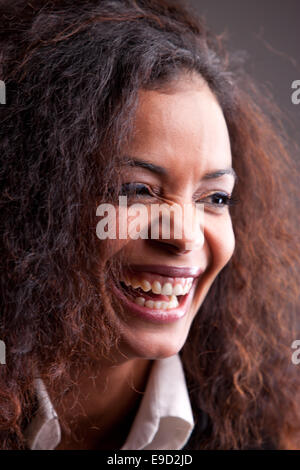 this girl laughs out loud necause of something really funny she heard Stock Photo