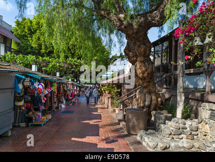 Market booths outside the Avila Adobe on Olvera Street in Los Angeles Plaza Historic District, Los Angeles, California, USA Stock Photo