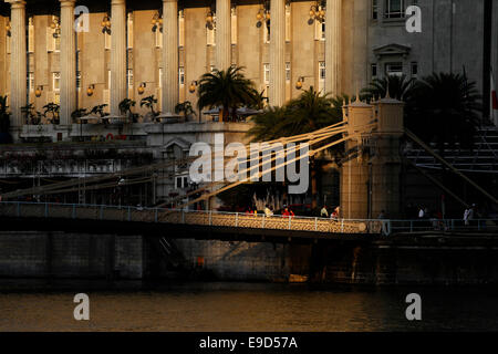 Cavenagh Bridge over the Singapore River with the Fullerton Hotel behind, Colonial District, Singapore Stock Photo