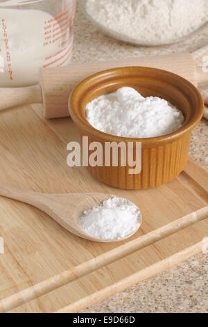 Baking Soda or Sodium bicarbonate used in baking as a leavening agent selective focus on the spoon Stock Photo