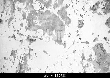 Background texture of white grungy concrete wall with peeling paint Stock Photo