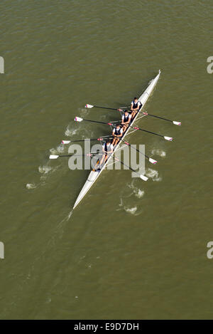 NOVI SAD, SERBIA - OCTOBER 18, 2014: Four men rowing on Danube River in Novi Sad on traditional remote regatta competition. Stock Photo