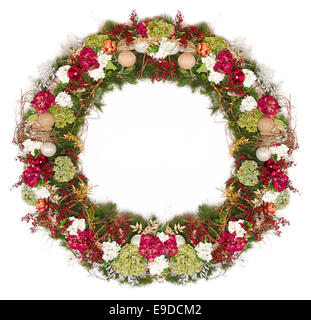 Holiday Wreath: A natural handcrafted Holiday Wreath with soft lighting isolated against a white background. Stock Photo