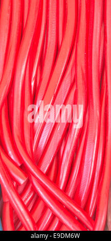 Red chewy strawberry laces as a background image Stock Photo