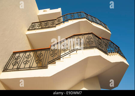 Spiraling staircase on outside of a large building Stock Photo