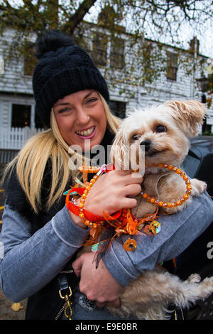 London, UK.  October 26th 2014. Dogs rescue and re-homing charity All Dogs Matter hold their annual Halloween fancy dress dog walk on Hampstead heath. PICTURED: Zoe with Poppy the Yorkie-poo. Credit:  Paul Davey/Alamy Live News Stock Photo