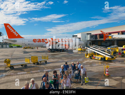 Passengers boarding aircraft Stock Photo