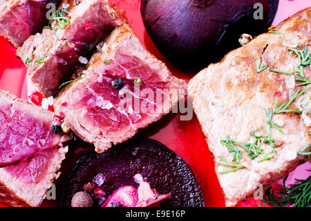 Delicious beef steaks with beetroot and apples gourmet rare Stock Photo