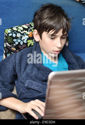 Boy uses his home computer Stock Photo