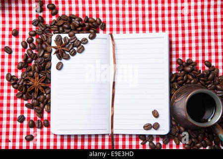 Blank paper, coffee bean and coffee cup on wood table Stock Photo