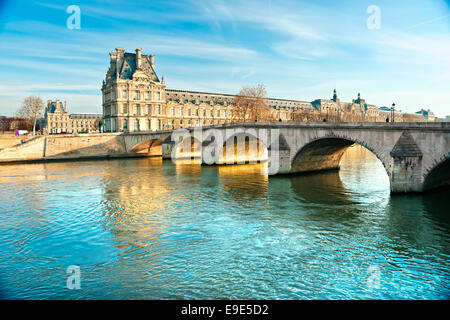 View of the Louvre Museum and Pont ses arts, Paris - France Stock Photo