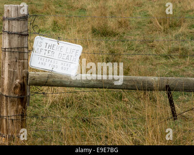 Humorous No Trespassing  Sign, Ranch Property Line, South Dakota, SD, USA Stock Photo