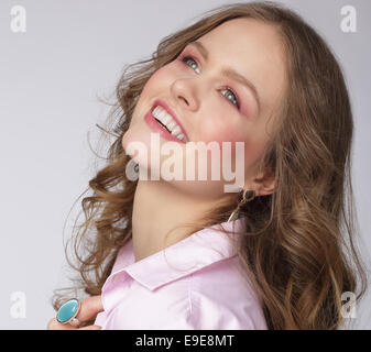 Positive Emotions. Delighted Attractive Woman Looking Up Stock Photo