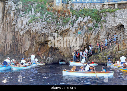 Tourists in line and in small boats waiting to enter the famous Blue Grotto on the island of Capri, Italy Stock Photo