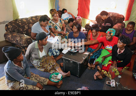 Women of a loan-self-help group, meeting of a saving and lending community. Township Lubuto of  Ndola, Zambia Stock Photo