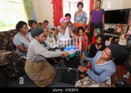 Women of a loan-self-help group, meeting of a saving and lending community. Township Lubuto of  Ndola, Zambia Stock Photo