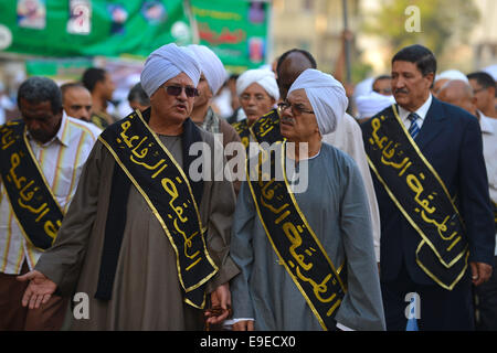 Cairo, Egypt. 26th Oct, 2014. Members of Egyptian sufi muslim group parade the street during a ritual to commemorate the Hijri New Year, also known as Islamic New Year, in Cairo on October 26, 2014. The Islamic year lasts for about 354 days and consists of 12 months. Muharram is the first month and some Muslims mark the start of the Islamic year on the first day of Muharram Credit:  Amr Sayed/APA Images/ZUMA Wire/Alamy Live News Stock Photo