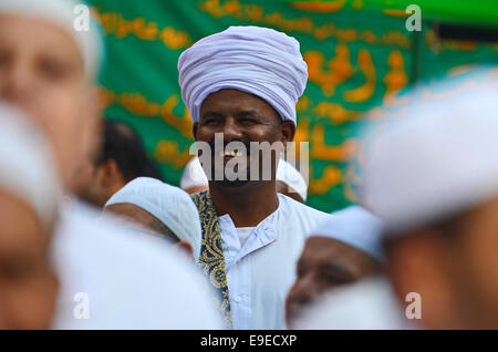 Cairo, Egypt. 26th Oct, 2014. Members of Egyptian sufi muslim group parade the street during a ritual to commemorate the Hijri New Year, also known as Islamic New Year, in Cairo on October 26, 2014. The Islamic year lasts for about 354 days and consists of 12 months. Muharram is the first month and some Muslims mark the start of the Islamic year on the first day of Muharram Credit:  Amr Sayed/APA Images/ZUMA Wire/Alamy Live News Stock Photo