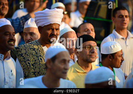 Cairo, Egypt. 26th Oct, 2014. Members of Egyptian sufi muslim group parade the street during a ritual to commemorate the Hijri New Year, also known as Islamic New Year, in Cairo on October 26, 2014. The Islamic year lasts for about 354 days and consists of 12 months. Muharram is the first month and some Muslims mark the start of the Islamic year on the first day of Muharram Credit:  Amr Sayed/APA Images/ZUMA Wire/Alamy Live News Stock Photo