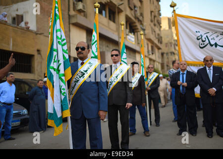 Cairo, Egypt. 26th Oct, 2014. Members of Egyptian sufi muslim group parade the street during a ritual to commemorate the Hijri New Year, also known as Islamic New Year, in Cairo on October 26, 2014. The Islamic year lasts for about 354 days and consists of 12 months. Muharram is the first month and some Muslims mark the start of the Islamic year on the first day of Muharram Credit:  Amr Sayed/APA Images/ZUMA Wire/Alamy Live News Stock Photo