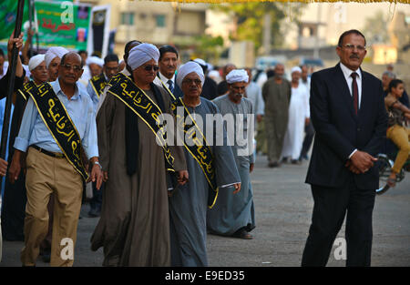 Cairo, Egypt. 26th Oct, 2014. Members of Egyptian sufi muslim group parade the street during a ritual to commemorate the Hijri New Year, also known as Islamic New Year, in Cairo on October 26, 2014. The Islamic year lasts for about 354 days and consists of 12 months. Muharram is the first month and some Muslims mark the start of the Islamic year on the first day of Muharram Credit:  Amr Sayed/APA Images/ZUMA Wire/Alamy Live News Stock Photo