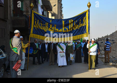 Cairo, Egypt. 26th Oct, 2014. Members of Egyptian sufi muslim group parade the street during a ritual to commemorate the Hijri New Year, also known as Islamic New Year, in Cairo on October 26, 2014. The Islamic year lasts for about 354 days and consists of 12 months. Muharram is the first month and some Muslims mark the start of the Islamic year on the first day of Muharram Credit:  Amr Sayed/APA Images/ZUMA Wire/Alamy Live News Stock Photo