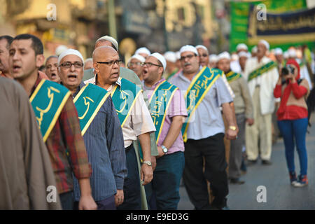 Cairo, Egypt. 26th Oct, 2014. Members of Egyptian sufi muslim group parade the street during a ritual to commemorate the Hijri New Year, also known as Islamic New Year, in Cairo on October 26, 2014. The Islamic year lasts for about 354 days and consists of 12 months. Muharram is the first month and some Muslims mark the start of the Islamic year on the first day of Muharram Credit:  Amr Sayed/APA Images/ZUMA Wire/Alamy Live News Stock Photo