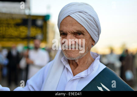 Cairo, Egypt. 26th Oct, 2014. Members of Egyptian sufi muslim group parade the street during a ritual to commemorate the Hijri New Year, also known as Islamic New Year, in Cairo on October 26, 2014. The Islamic year lasts for about 354 days and consists of 12 months. Muharram is the first month and some Muslims mark the start of the Islamic year on the first day of Muharram Credit:  Amr Sayed/APA Images/ZUMA Wire/Alamy Live News Stock Photo