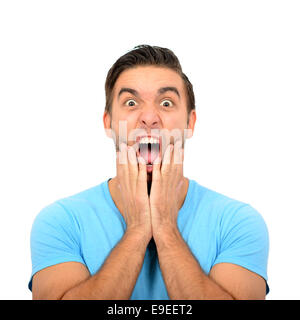 Portrait of angry man screaming and pulling hair against white background Stock Photo