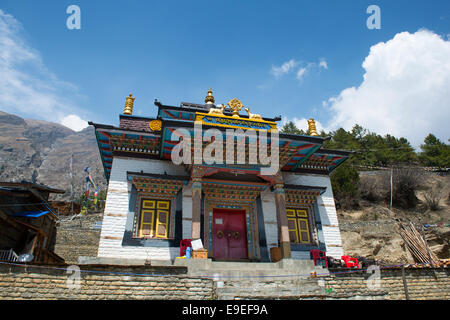 Buddhist temple in Upper Pisang on a Annapurna Circuit - most popular tourists trek in Himalayan mountain massive in Nepal. Stock Photo