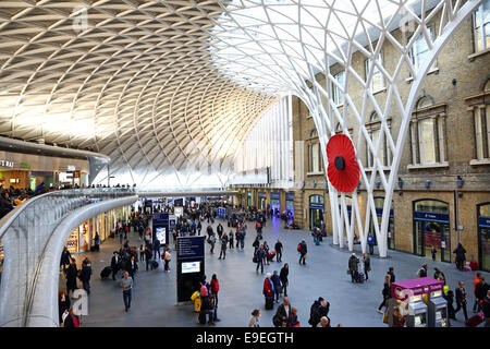 London, UK. 26th October 2014. A giant fibreglass Red Poppy measuring about five meters across has been installed at Kings Cross Station, London, England ahead of Remembrance Day Credit:  Paul Brown/Alamy Live News Stock Photo