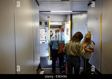 passengers on skybridge boarding aircraft in Canada Stock Photo