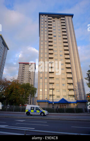 Police Van passing High Rise Flats in Camden, London Stock Photo