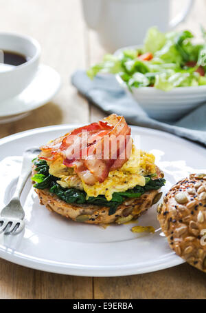 Bacon,scramble egg and steamed spinach on Pumpkin bread breakfast Stock Photo