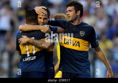 Buenos Aires, Argentina. 26th Oct, 2014. Juan Manuel Martinez (C) of Boca Juniors celebrates after scoring with his teammates Federico Carrizo (L) and Emmanuel Gigliotti during the match of the Argentinean First Division Tournament against Defensa y Justicia, at the Alberto J. Armando stadium, in Buenos Aires, Argentina, on Oct. 26, 2014. Credit:  Juan Roleri/TELAM/Xinhua/Alamy Live News Stock Photo