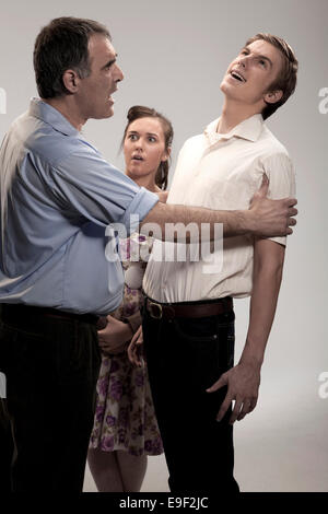 Character actors from a 1950's classic literature book act out key scenes Stock Photo