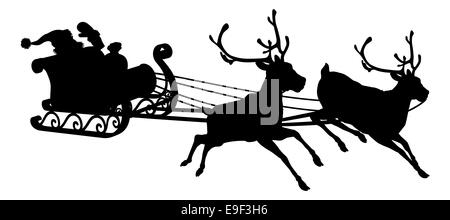 Santa sleigh silhouette of waving Santa Claus in his sleigh and reindeer Stock Photo