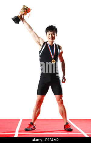 Athlete holding the trophy Stock Photo