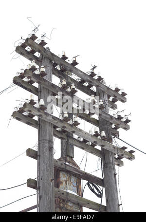 Old decrepit wooden telephone pole Stock Photo